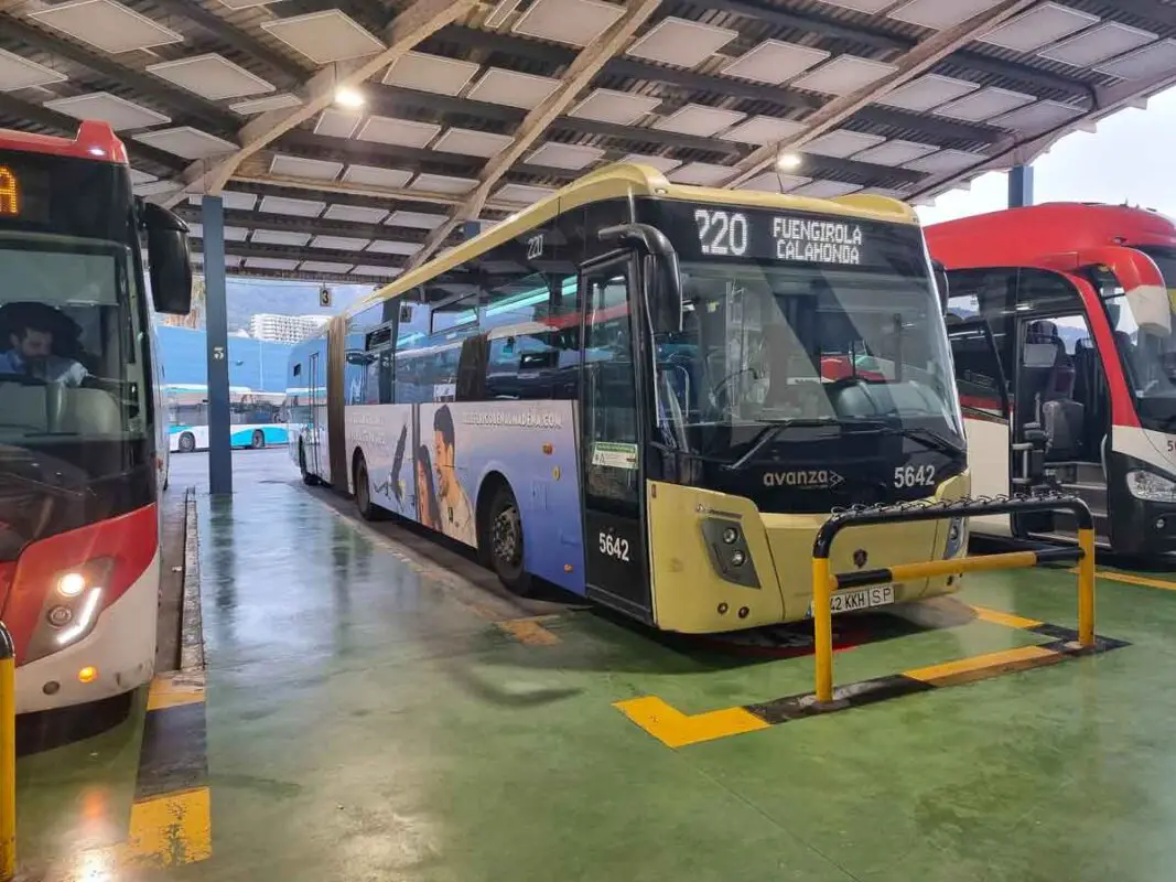 An Avanza bus in the Marbella bus station. The bus is dark yellow