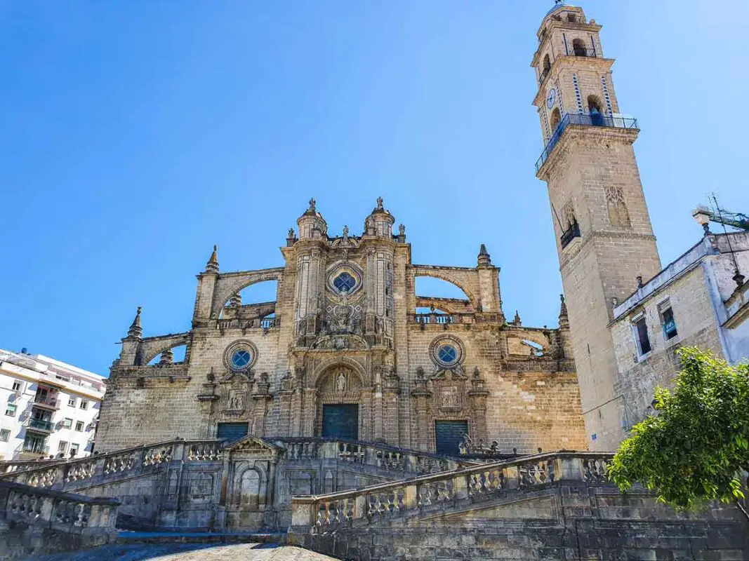 A wide angle photo with the Cahtedral in Jerez. On the right hand side you can see the minaret which is not the bell tower. It is a sunny day, with no clouds on the sky.